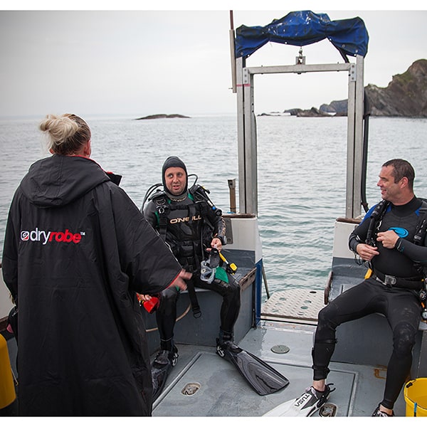 dryrobes on a dive boat