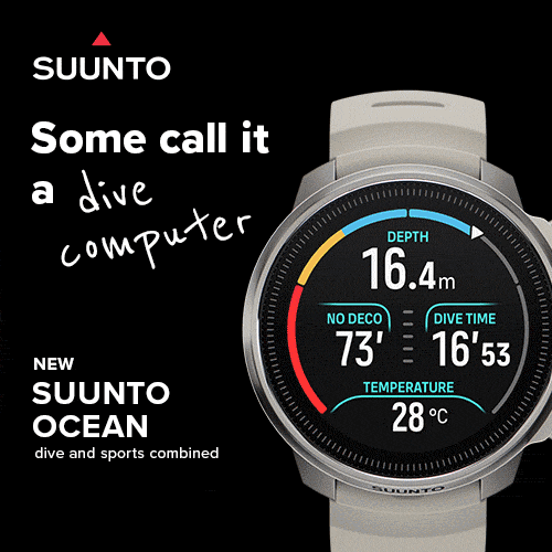 grey Suunto dive watch on a black background